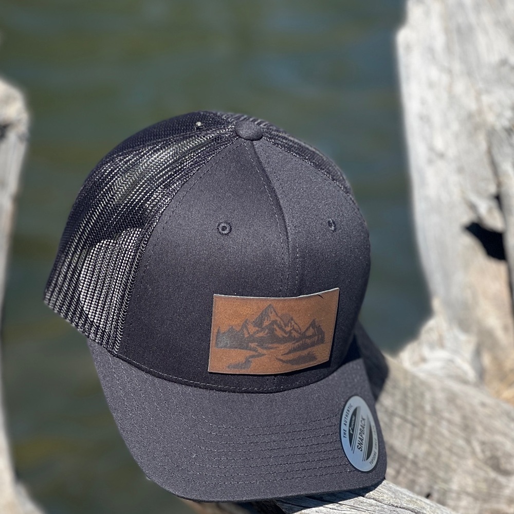 Brand New Black Tucker Hat.